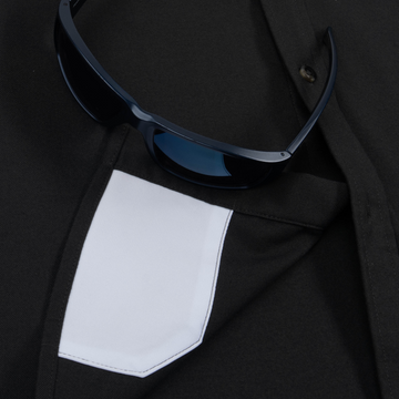 sunglasses with lens cleaner on shirt