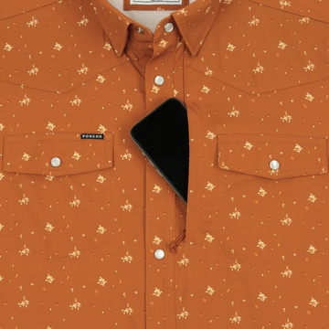 Close-up of The Fourth and Five shirt in rust with small floral prints and a phone tucked in the hidden chest pocket.