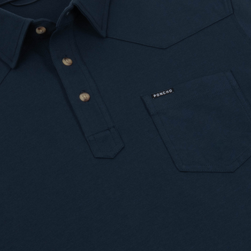 Close-up of navy shirt with buttons and pocket labeled The Front Porch by Poncho Outdoors
