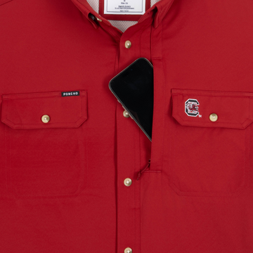 Phone in chest zipper pocket of shirt