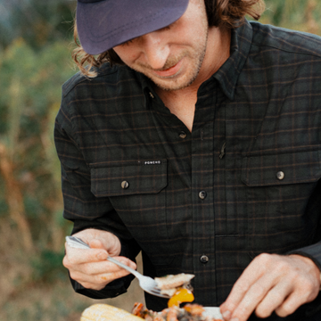 The Gloucester dark plaid shirt worn outdoors while enjoying a meal