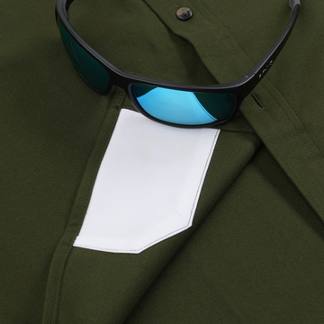 The Grizzly olive green men's outdoor shirt with white chest pocket and sunglasses
