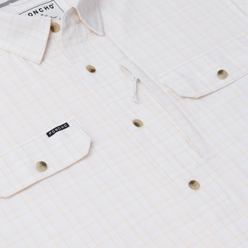 The Biloxi cream plaid shirt with buttoned chest pockets and soft neutral detailing