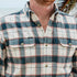 The Half Moon plaid button up shirt with chest pockets worn outdoors