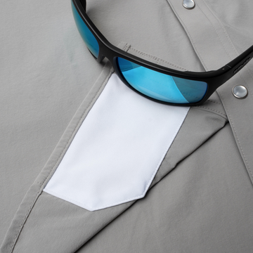 sunglasses with lens cleaner on shirt