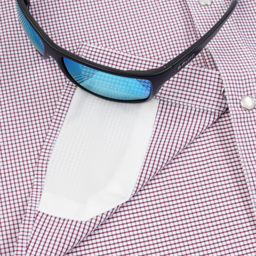 sunglasses with lens cleaner on shirt