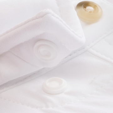 Closeup of collar snaps on collar of shirt