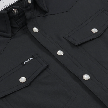 Close-up of black button-up shirt with pockets from The Jake collection