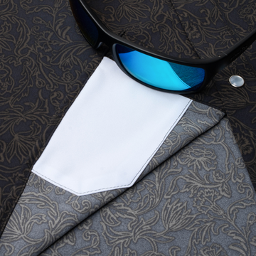 sunglasses with lens cleaner on shirt
