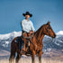 The Judd light wash men's western outdoor shirt worn horseback against a mountain backdrop