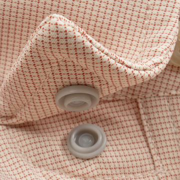 Closeup of collar snaps on collar of shirt