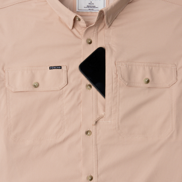 Phone in chest zipper pocket of shirt