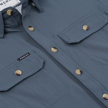 Close-up of The Little Tuna shirt with wooden buttons and chest pockets