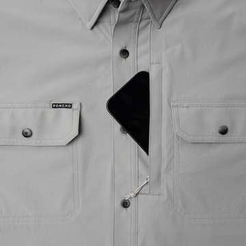 phone in chest pocket of shirt