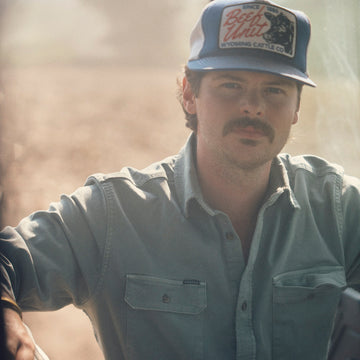 The Mentone shirt worn by a man outdoors in warm sunlight