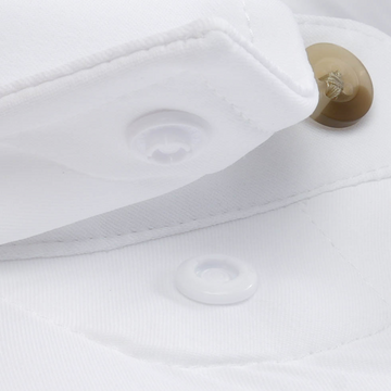 The Mountain Goat white shirt with a close-up view of its button fastening