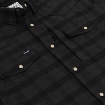The North Rim dark charcoal plaid western shirt with pearl snap closures and chest pockets for outdoor wear