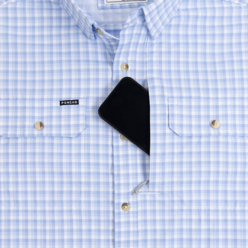 Closeup of sunglasses with lens cleaner on shirt