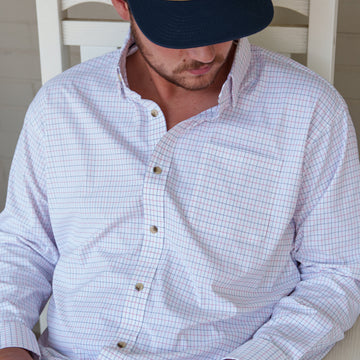 The Open Flame checked button down shirt worn by a man on a porch