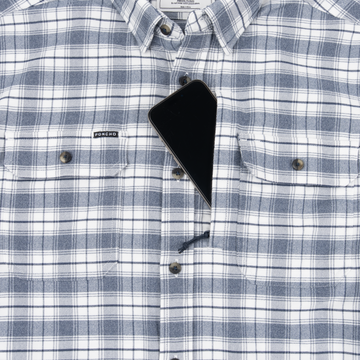 Close-up of The Pagosa shirt in blue and white plaid with a phone partially tucked into the chest pocket.