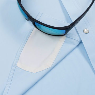 sunglasses with lens cleaner on shirt