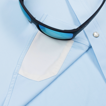 sunglasses with lens cleaner on shirt
