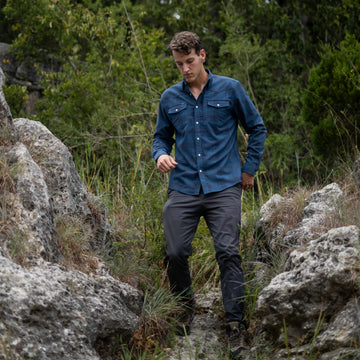 man walking wearing the power river flannel shirt