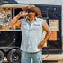 Man taking a drink wearing a Short Sleeve Denim Cutoff shirt
