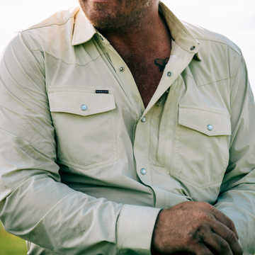man wearing tan long sleeve tuff-thread shirt