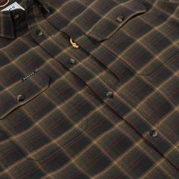 The Rusty Saw plaid shirt with buttoned chest pockets and Poncho Outdoors label