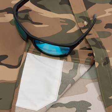 Closeup of sunglasses with lens cleaner on shirt