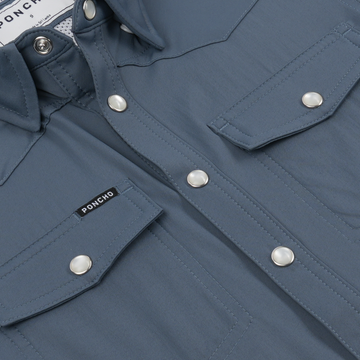 Close-up of The Sardine shirt front with snap buttons and chest pockets