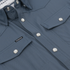 Close-up of The Sardine shirt front with snap buttons and chest pockets