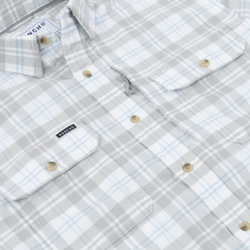 The Snowcat mens outdoor shirt in gray and light blue plaid with button front and chest pockets
