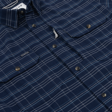 The Sturgeon navy plaid button-up shirt with chest pockets and Poncho label