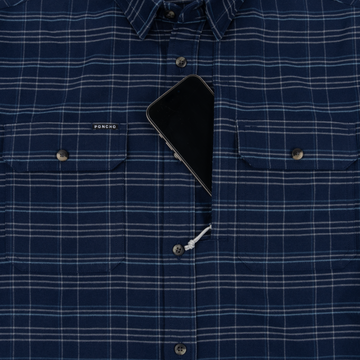 The Sturgeon blue plaid shirt with button pockets and a phone in the center opening