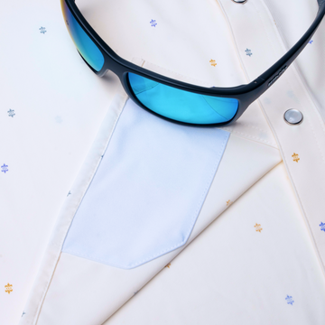 sunglasses with lens cleaner on shirt