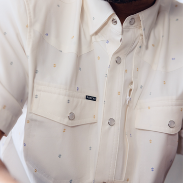 man wearing the tchoupitoulas shirt