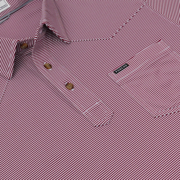 The Top Row red and white striped shirt with button placket and Poncho label