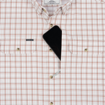 Phone in chest zipper pocket of shirt