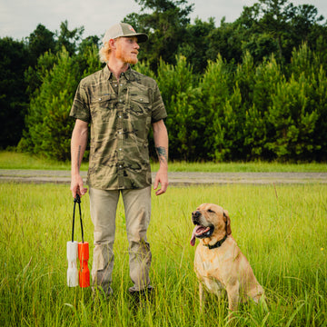 man with dog wearing victoria shirt