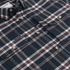 Close-up of The Willamette plaid shirt with button details and chest pockets