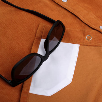 Detail shot of sunglasses on lens cleaning cloth