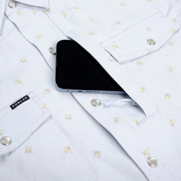 closeup of phone going into chest pocket