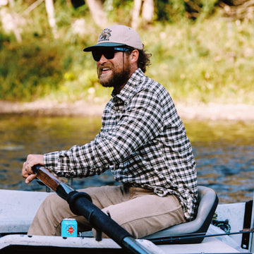 Man rowing drift boat in The Boone