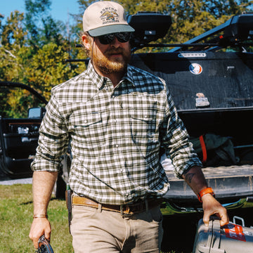 Man carrying gear in The Boone shirt