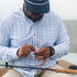 Man tying on a fly in The Croaker shirt