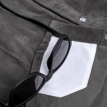 Detail shot of lens cloth and sunglasses