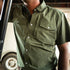 man wearing green short sleeve tuff-thread shirt