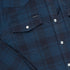 close up of blue and black western flannel